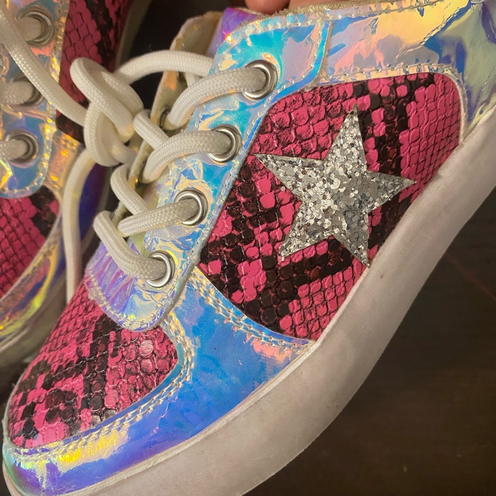 The Ayra sneaker from INC features a lace-up design with fun all over prints
